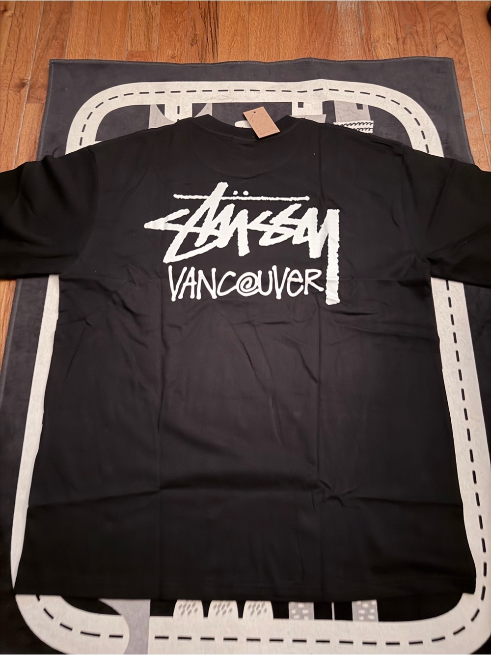 Stussy Black Tee with White Vancouver Graphic